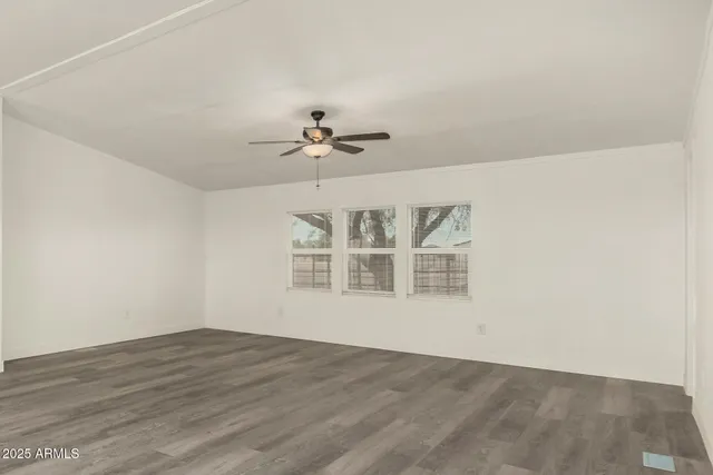 a view of a livingroom with wooden floor