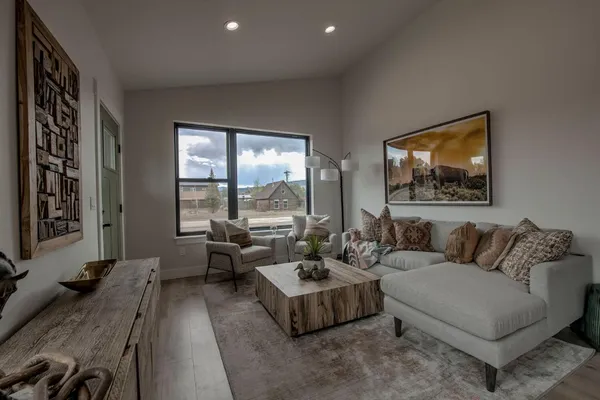 a living room with furniture and a large window