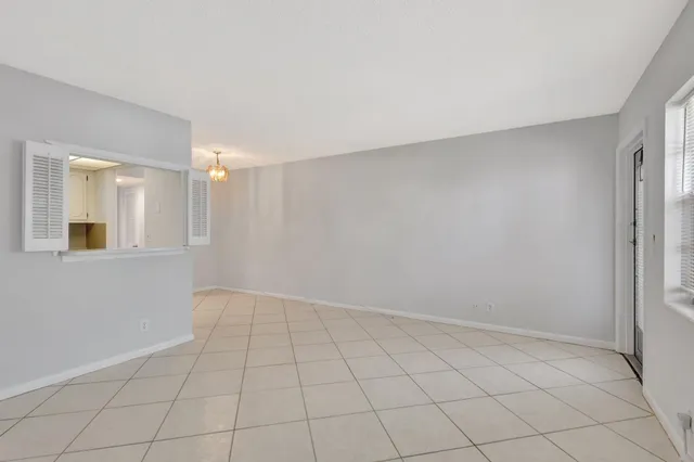 a view of an empty room and window