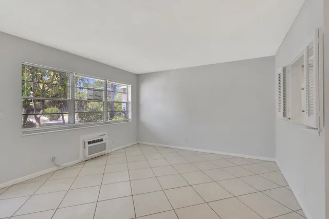 a view of an empty room with a window