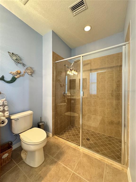 7212 Hamilton Road, Unit 7212 Bradenton, FL 34209 - Photo 21 of 46 a bathroom with a toilet and a shower