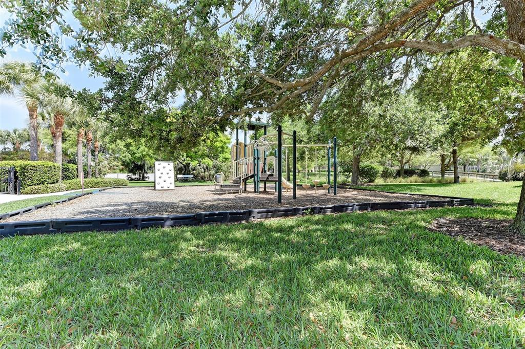 7212 Hamilton Road, Unit 7212 Bradenton, FL 34209 - Photo 39 of 46 a view of a park with large trees