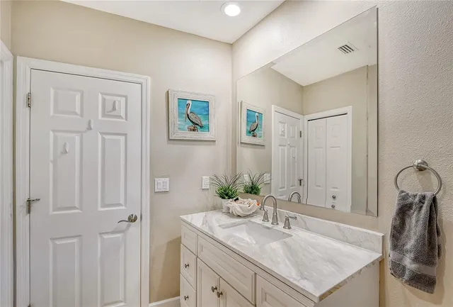 a bathroom with 2 sink and a mirror