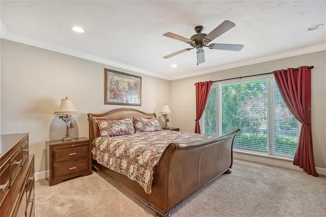 a view of a house with pool and sitting area