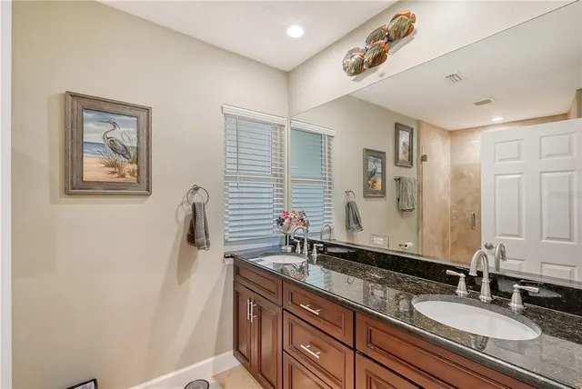 a view of a house with swimming pool and porch with furniture