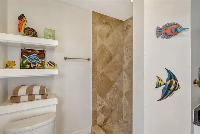 a view of a roof deck with a table and chairs