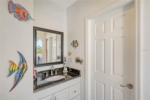 a view of swimming pool with outdoor seating and plants