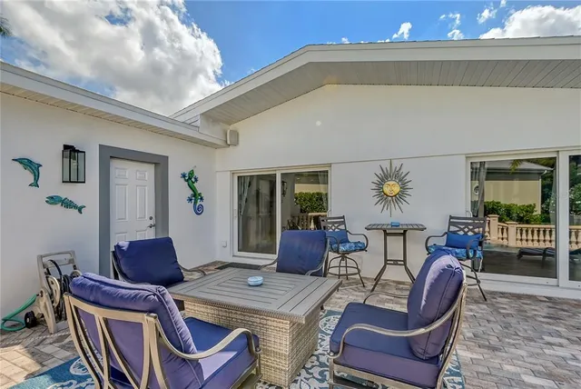 a view of a balcony and floor to ceiling window and wooden fence