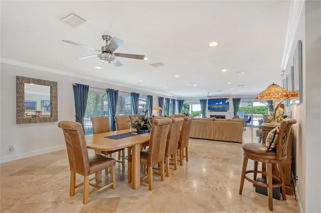 a living room with furniture fireplace and a large window