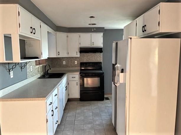188 Waynesburg Road Washington, PA 15301 - Photo 6 of 17 a kitchen with a refrigerator sink and stove