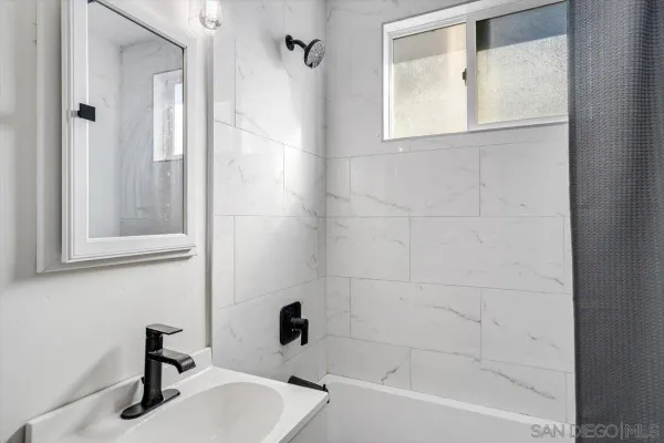 a bathroom with a sink and a bathtub