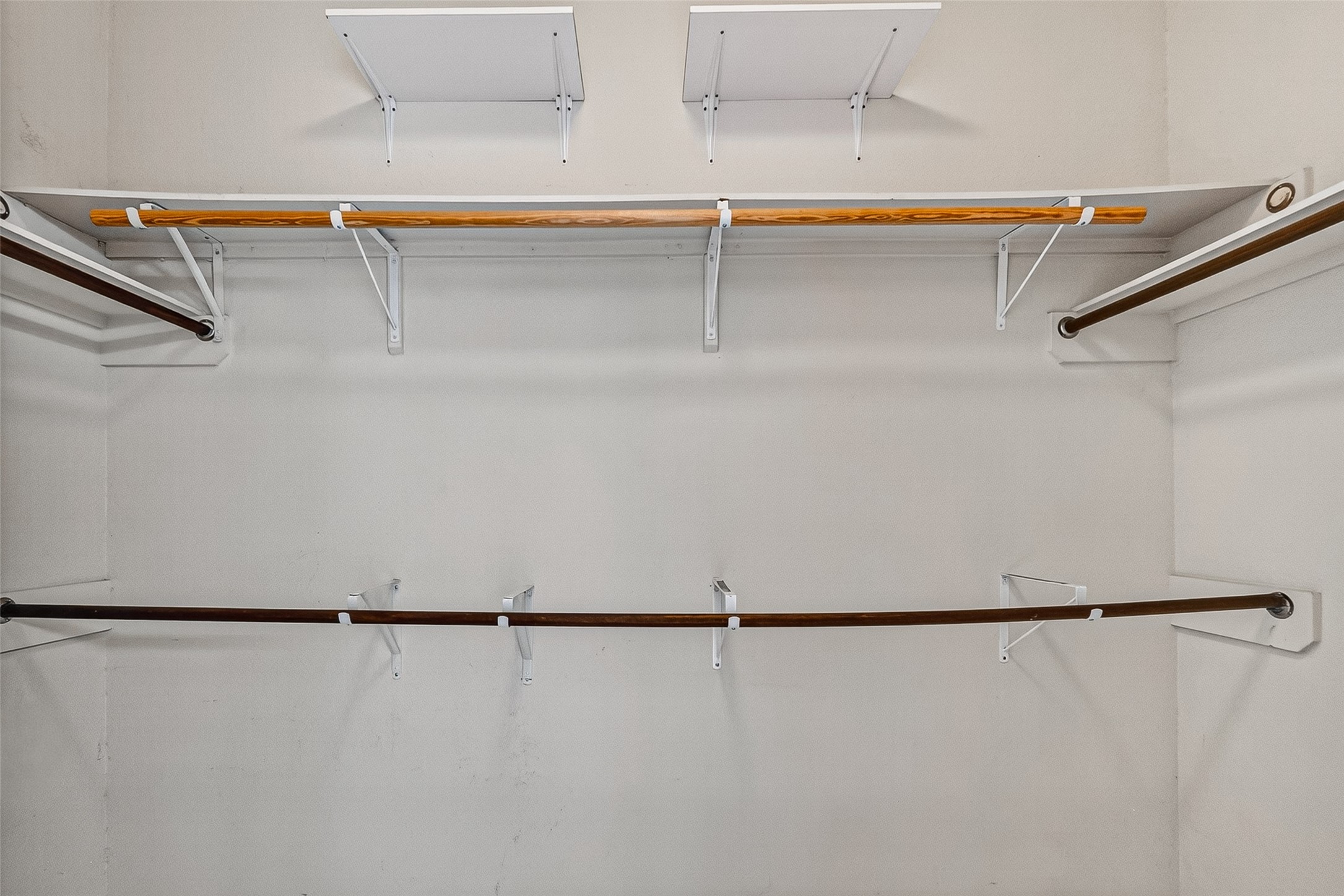 2702 Modano Court Fresno, TX 77545 - Photo 18 of 46 a view of a room with racks on the wall