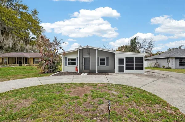 front view of a house with a patio yard