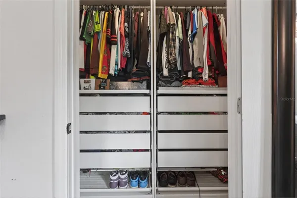 a view of a closet with storage