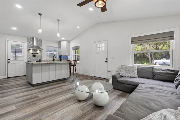 a living room with furniture and a large window
