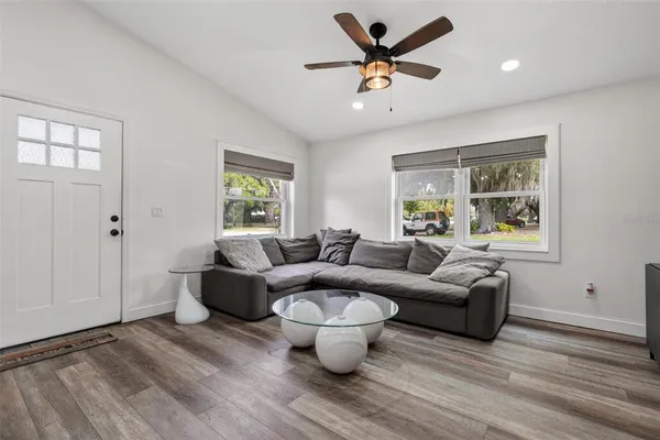 a living room with furniture and a large window