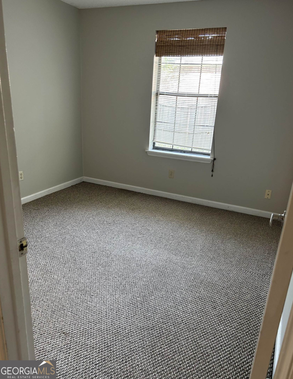 406 Admiral's Walk Drive St. Marys, GA 31558 - Photo 5 of 7 an empty room with a window