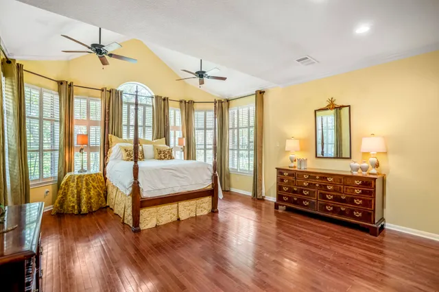 a open kitchen with cabinets and white stainless steel appliances