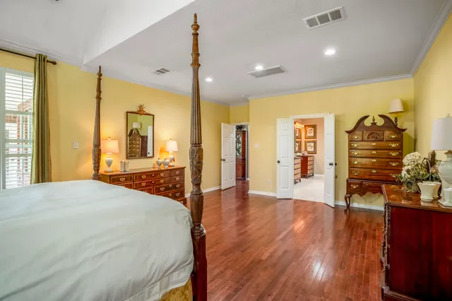 a living room with a bed furniture and a large window