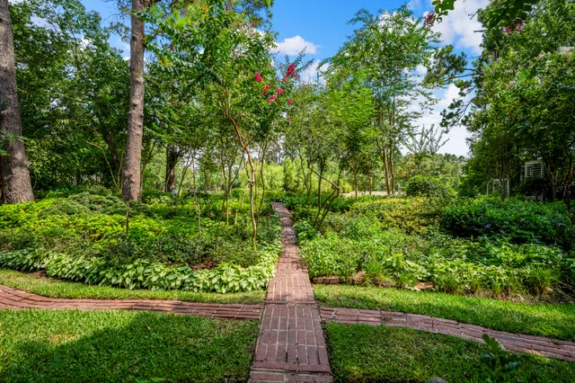 a view of bathroom with a mirror and sink