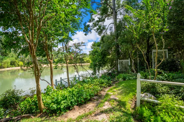 a balcony with wooden floor and fence