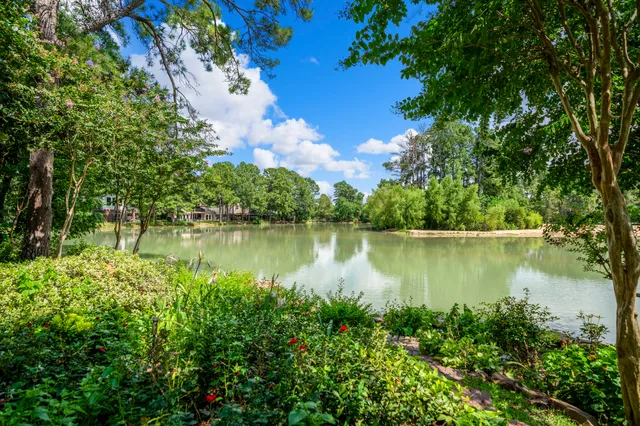 a view of house with backyard and garden