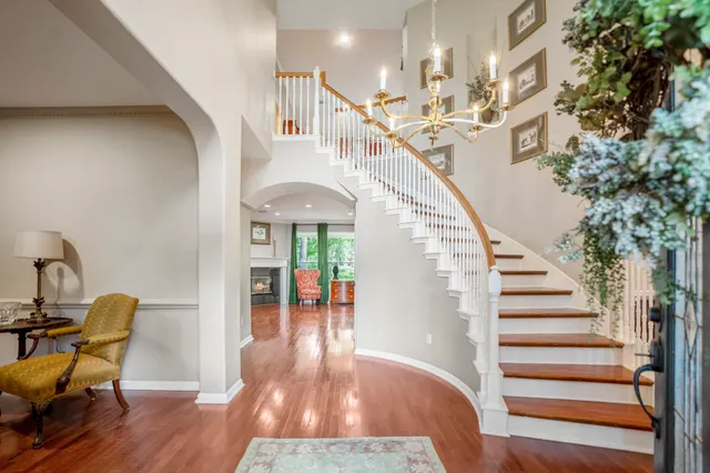 a view of entryway and hall with wooden floor
