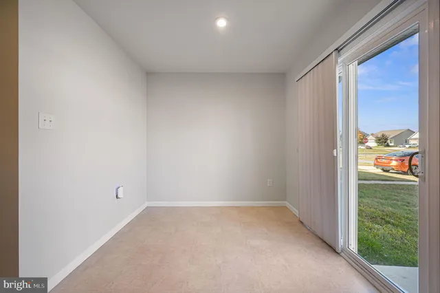 a view of an empty room and window