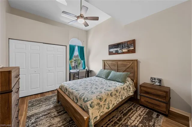 a bedroom with a bed dresser and a window