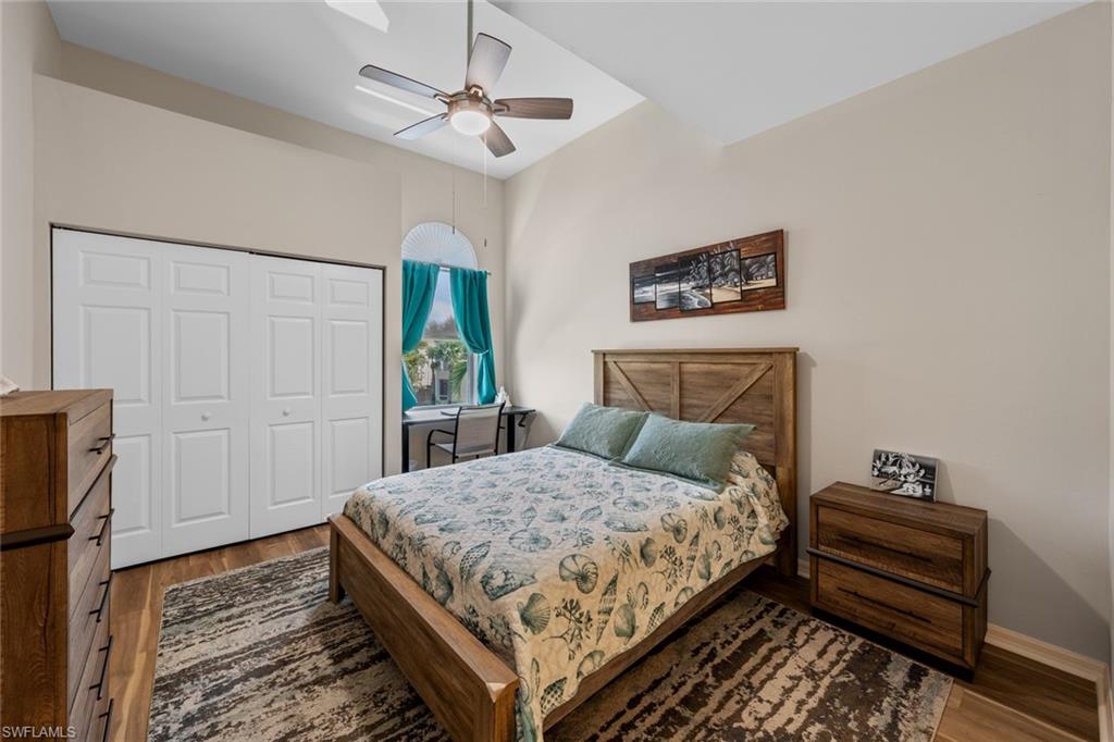 4306 Bellasol Circle, Unit 3422 Fort Myers, FL 33916 - Photo 23 of 41 Bedroom featuring wood finished floors, a closet, and a ceiling fan
