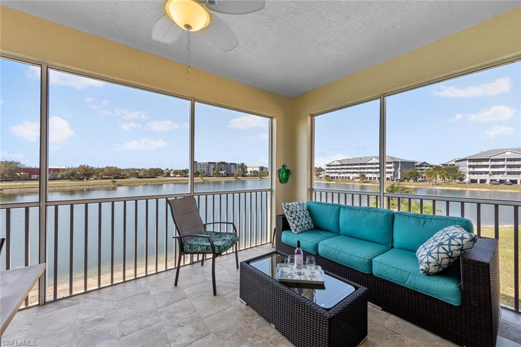 4306 Bellasol Circle, Unit 3422 Fort Myers, FL 33916 - Photo 26 of 41 Screened Lanai featuring a water view