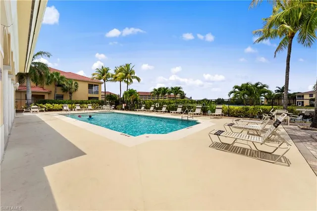 a view of a lake with a table and chairs