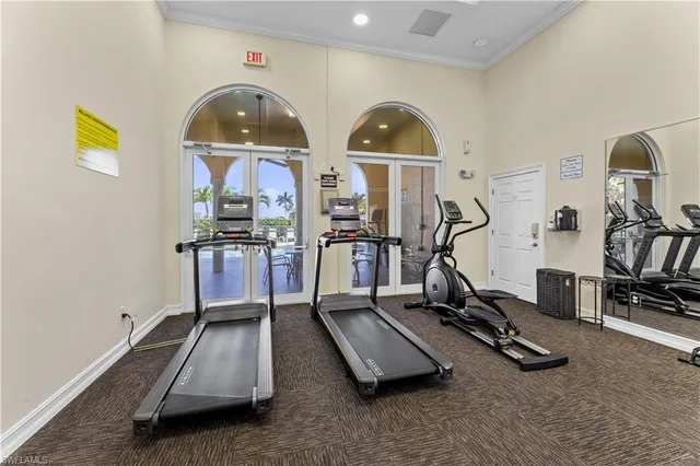 a room with gym equipment and gym equipment