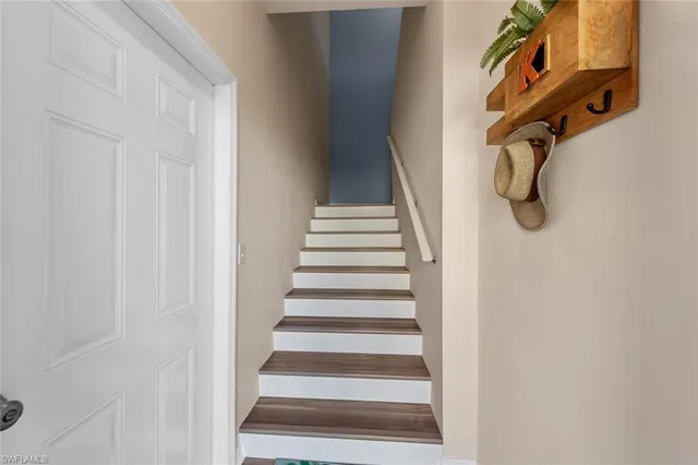 a view of staircase with white walls