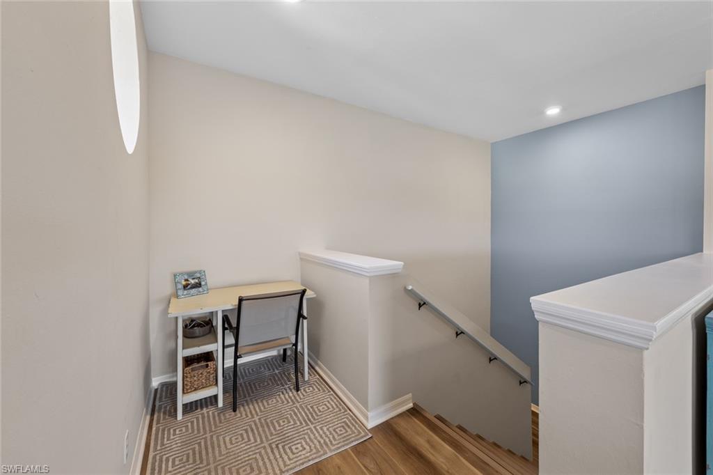 4306 Bellasol Circle, Unit 3422 Fort Myers, FL 33916 - Photo 7 of 41 Stairs featuring wood finished floors and recessed lighting