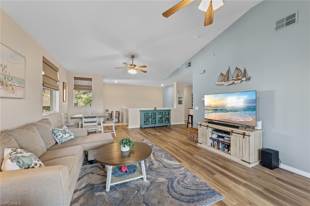 4306 Bellasol Circle, Unit 3422 Fort Myers, FL 33916 - Photo 8 of 41 Living room featuring light wood-style flooring and ceiling fan