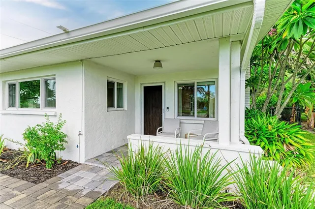 a view of a house with a small yard