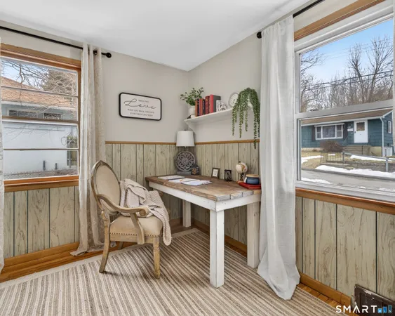 a dining room with furniture window and outdoor view