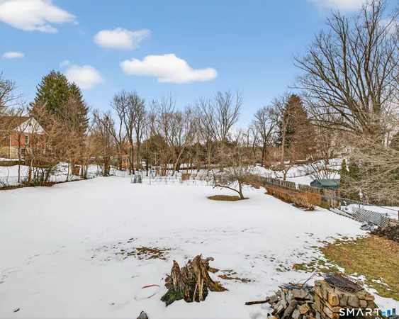 a view of a terrace with furniture and a fire pit