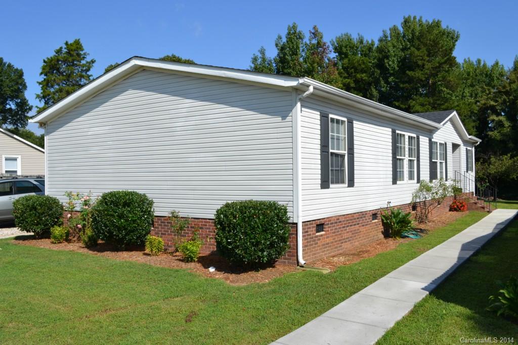 774 Sunderland Road Southwest Concord, NC 28027 - Photo 1 of 12 a view of a house with yard and plants