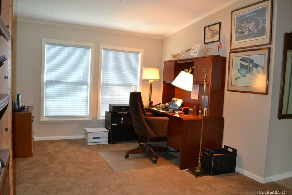 774 Sunderland Road Southwest Concord, NC 28027 - Photo 5 of 12 a view of a workspace with furniture and a window