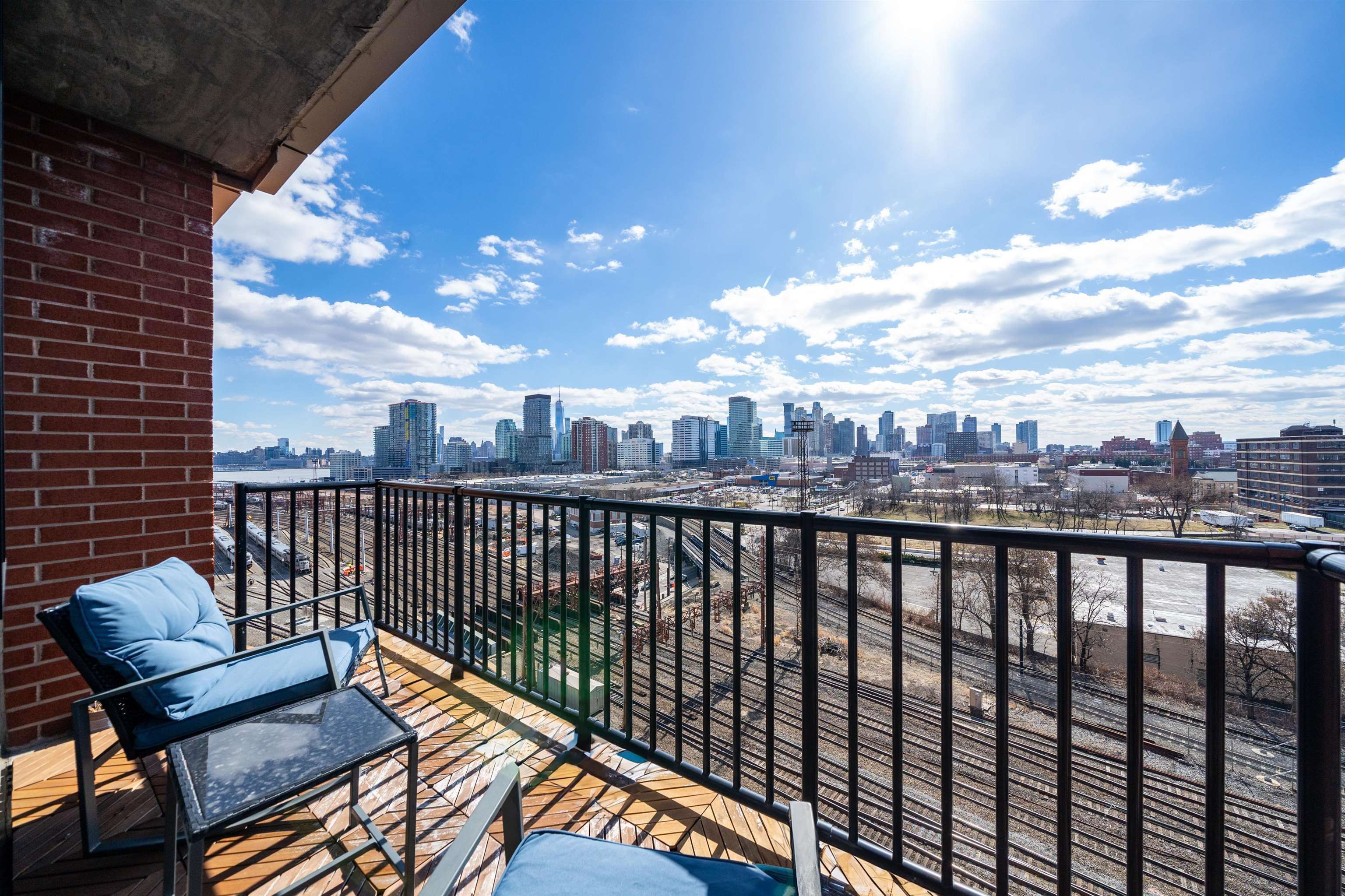 700 Grove Street, Unit 12P Jersey City, NJ 07310 - Photo 2 of 7 a view of city from a balcony