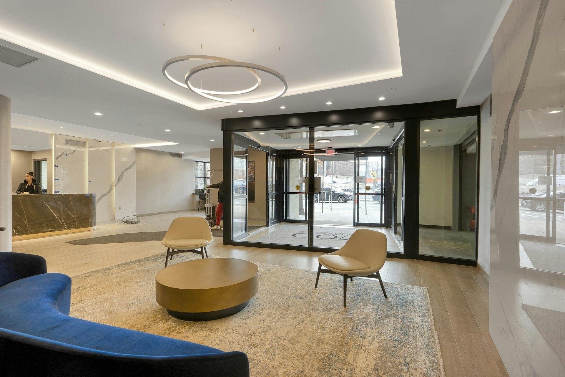 700 Grove Street, Unit 12P Jersey City, NJ 07310 - Photo 7 of 7 a living room with furniture and a large window