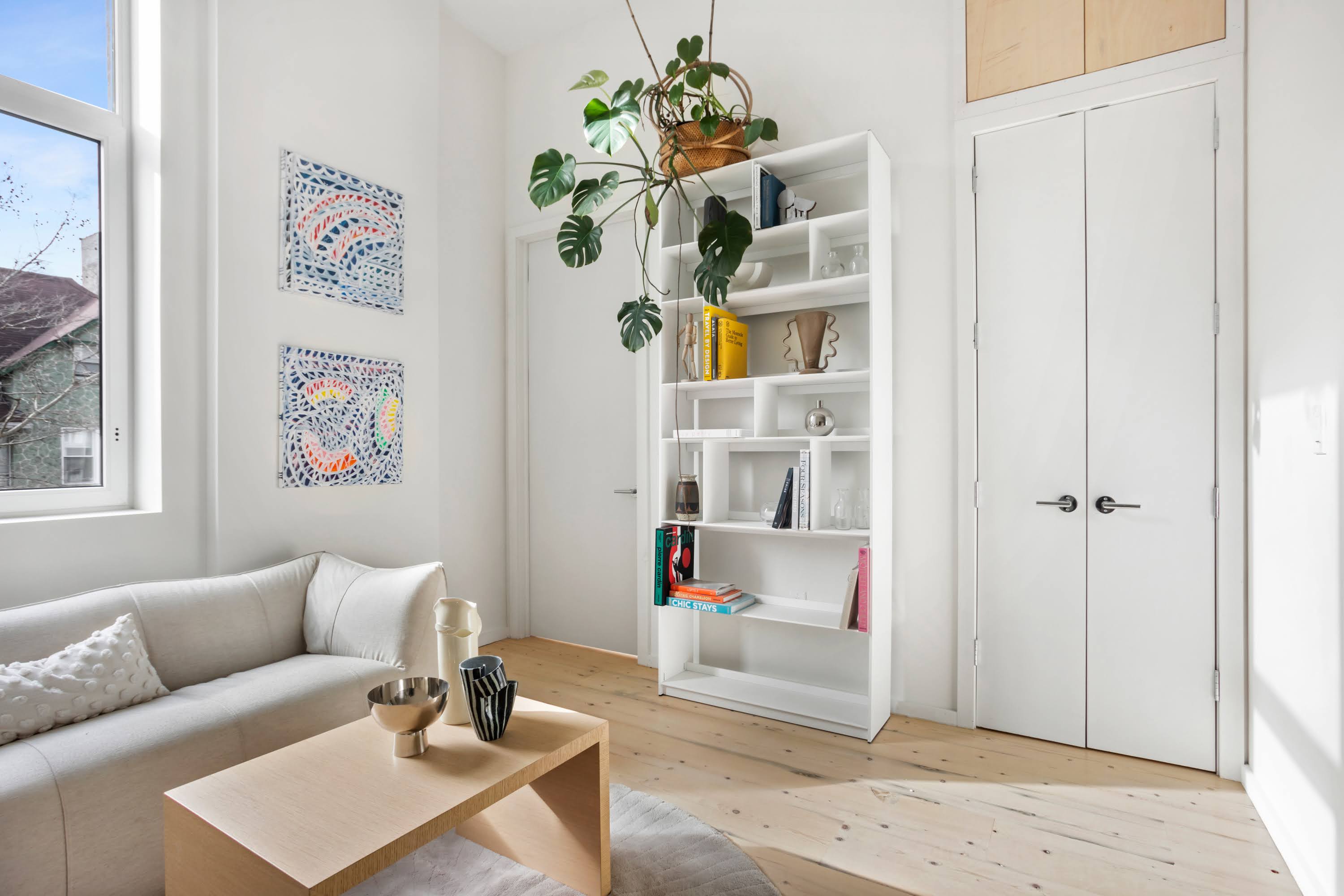457 West 150th Street, Unit 1C Manhattan, NY 10031 - Photo 1 of 4 a living room with furniture and a window