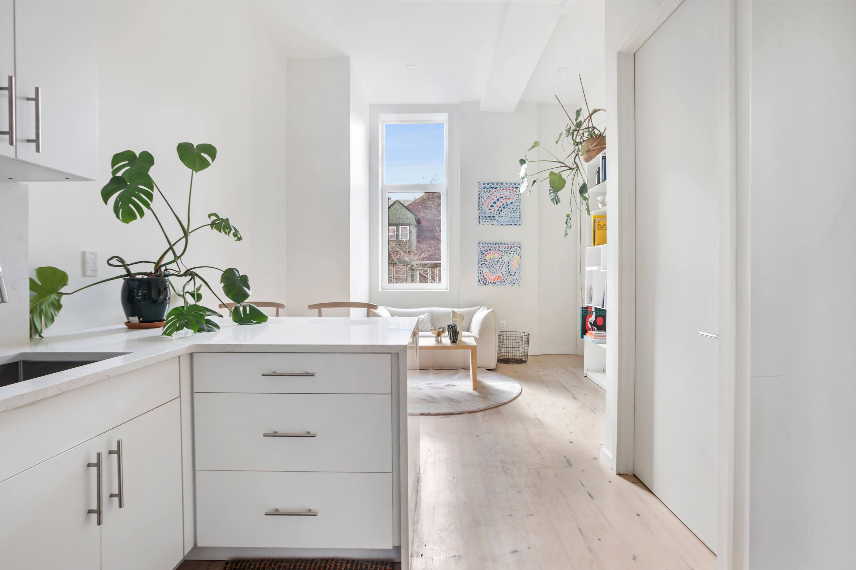 457 West 150th Street, Unit 1C Manhattan, NY 10031 - Photo 4 of 4 a spacious en suite bathroom with a granite countertop sink and a mirror