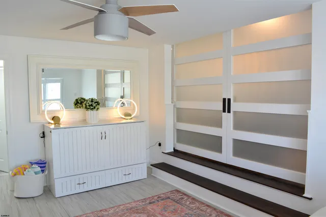 a room with a window and flowerpot