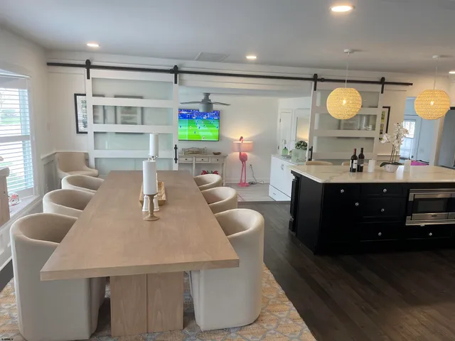 a dining room with furniture and window