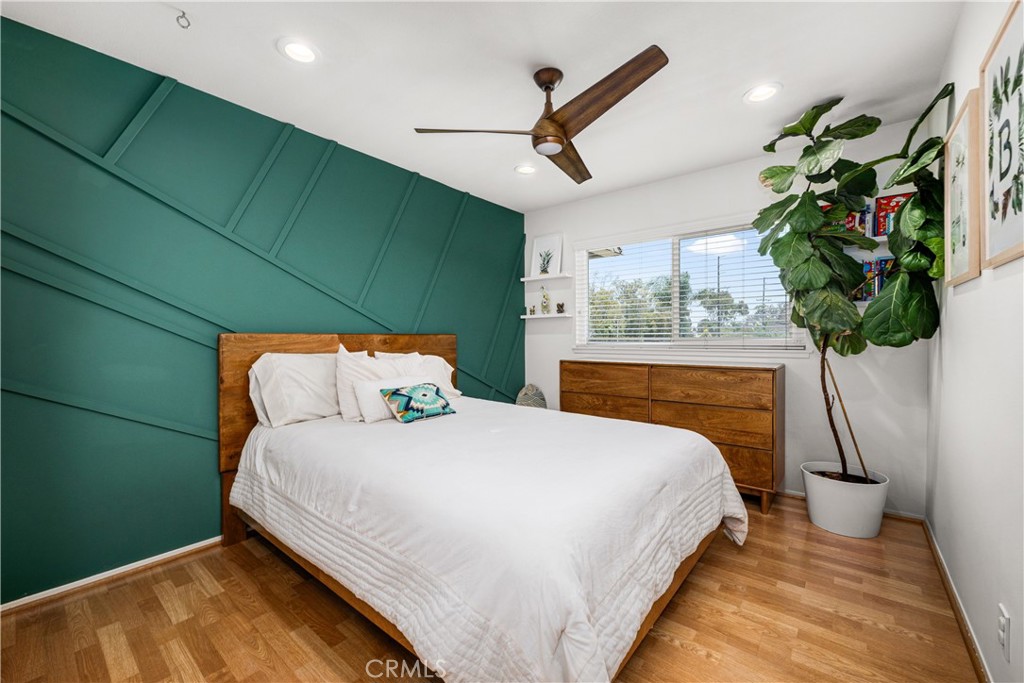 4237 Larwin Avenue Cypress, CA 90630 - Photo 32 of 48 a bedroom with a bed and a potted plant