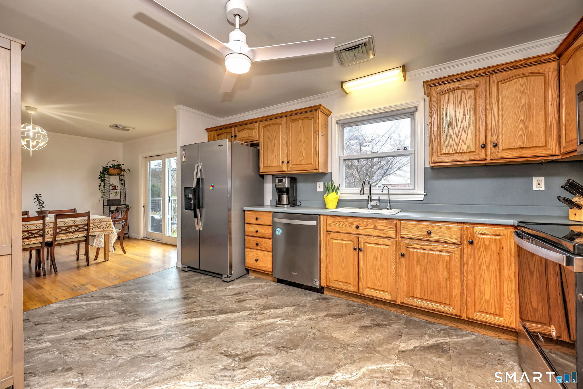 4 Fairview Road Woodbridge, CT 06525 - Photo 6 of 37 Spacious kitchen with an open flow to the dining room, featuring a functional layout and exciting potential for modern updates.