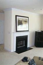5601 Fairview Road, Unit 17 Charlotte, NC 28209 - Photo 2 of 7 a living room with a fireplace